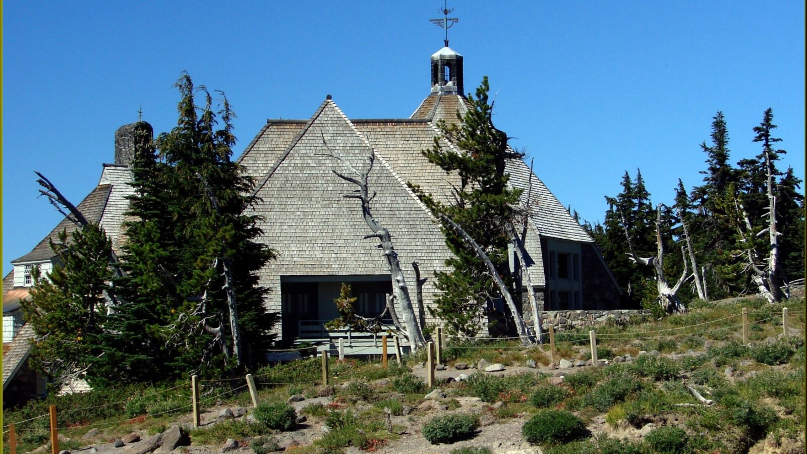 Timberline Lodge on Mount Hood, Oregon, with its shingled roof and bell tower among evergreen trees